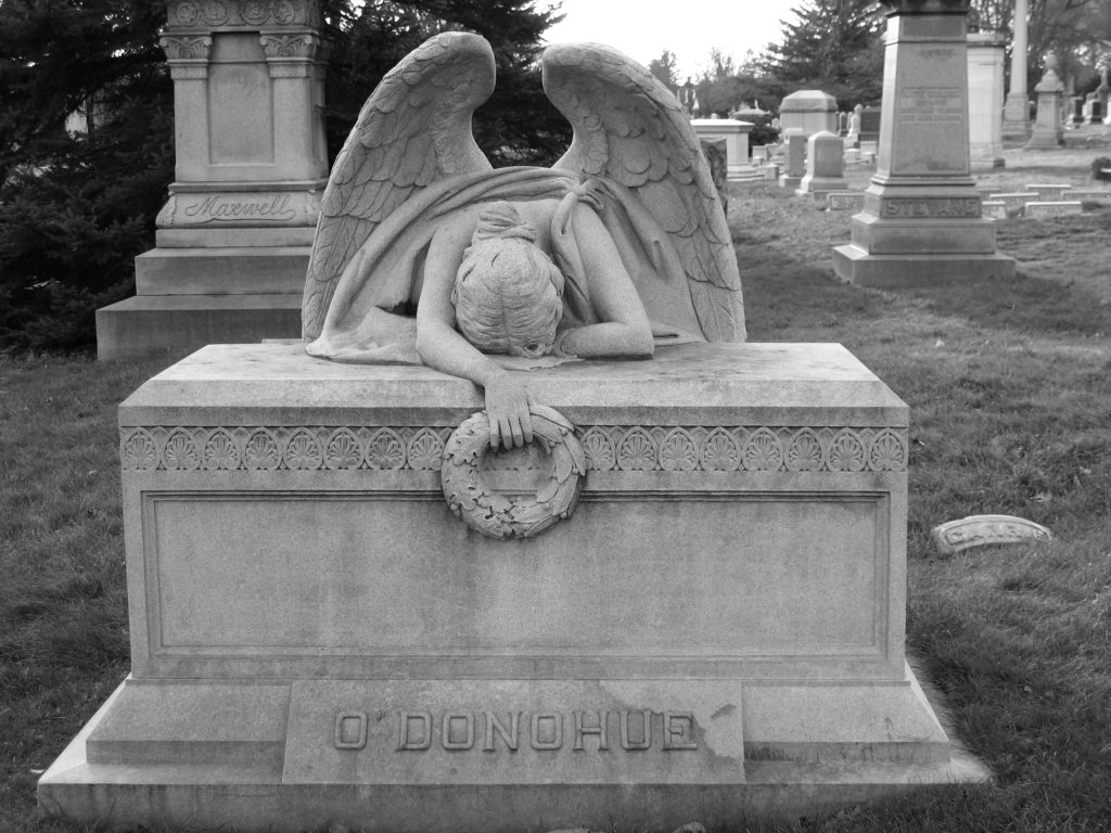 Angel on top of gravestone in the Greenwood Cemetery in Brooklyn - Black & White